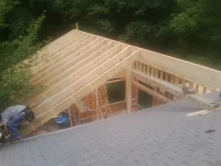Framing a new roof addition that ties into an existing shingle roof in Franklin